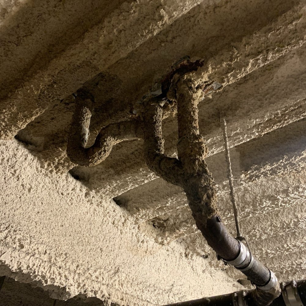 Candet Properties - Water damage to concrete over pipes and parking garage ceiling. - Real Estate Services Near Me