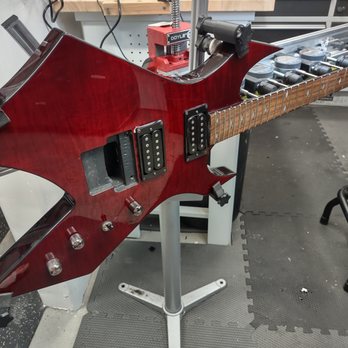 Electric Eye - Setting up a BC Rich Warlock in our proprietary neck jig - Musical Instrument Services Near Me Electric Eye - Setting up a BC Rich Warlock in our proprietary neck jig - Musical Instrument Services Near Me