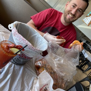 Hot N Juicy Crawfish - Happy Husband starting his work on "the drool" medium heat with hot and spicy. - Seafood Near Me - Phoenix, Arizona Hot N Juicy Crawfish - Happy Husband starting his work on "the drool" medium heat with hot and spicy. - Seafood Near Me - Phoenix, Arizona