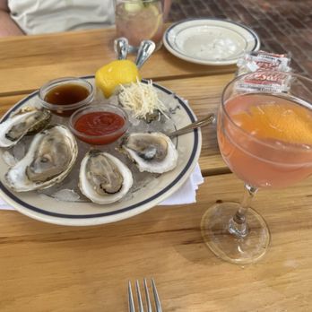 Clark's Oyster Bar - Austin - Oysters and a ruby red vodka martini. - Seafood Near Me - Austin, Texas