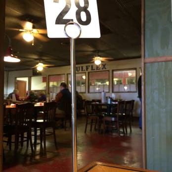 Hoot's BBQ - waiting my turn. sign near register says, 'burgers take 15 minutes to grill, bbq is faster.' guess I try the bbq. - Barbeque Near Me - McGehee, Arkansas