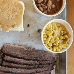 Brisket plate with pintos and creamed corn.