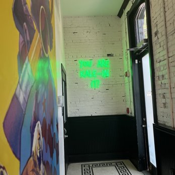 South Block - a hallway with graffiti and a neon sign - Juice Bars & Smoothies Near Me - Washington, DC, District of Columbia
