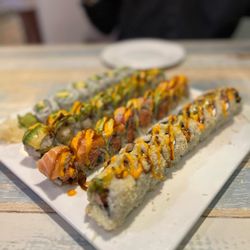 Tokyo Sushi - Monster Roll (closest), California roll (Left most), Old Willy Street Roll (2nd left most), can't remember the 3rd