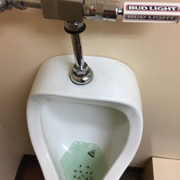 a urinal in a bathroom a urinal in a bathroom