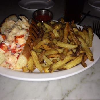 Neptune Oyster - Lobster Roll with a large helping of Kick-Ass fries - Seafood Near Me - Boston, Massachusetts Neptune Oyster - Lobster Roll with a large helping of Kick-Ass fries - Seafood Near Me - Boston, Massachusetts