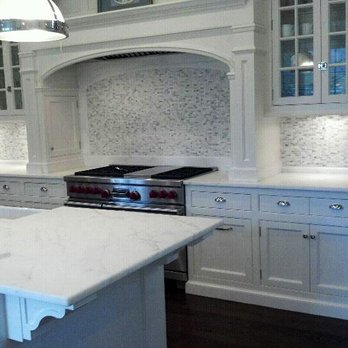 Stone Decoration - a kitchen with white cabinets and marble countertops - General Contractors Near Me - Peekskill, New York Stone Decoration - a kitchen with white cabinets and marble countertops - General Contractors Near Me - Peekskill, New York