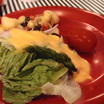 Cicis Pizza - a red plate with a salad on it - Pizza Near Me - Orangeburg, South Carolina