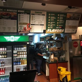 Wingstop - Front of the store- mop bucket is slightly off putting but no one was using it when I walked in. - Chicken Wings Near Me - Humble, Texas