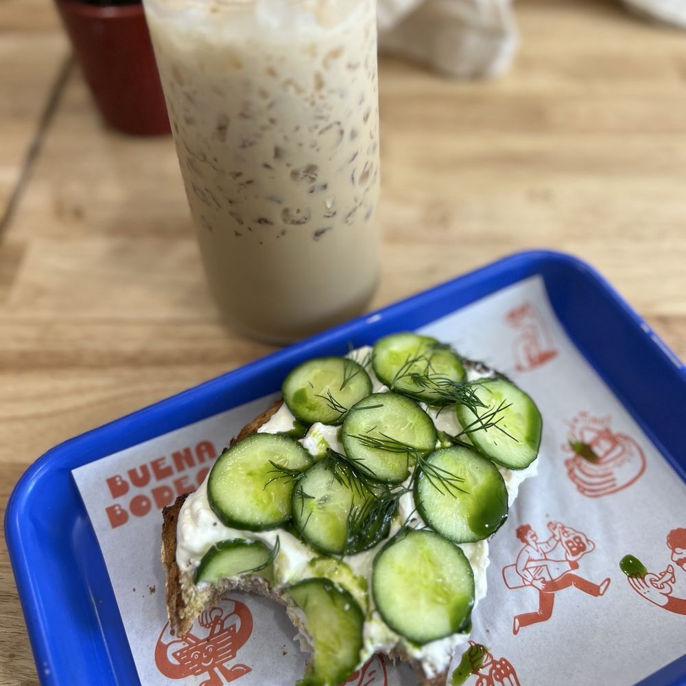 Buena Bodega - Iced latte with toasted coconut syrup, toast with whipped feta and cucumber. - Coffee & Tea Near Me - Ventura, California