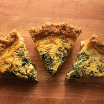 Source Bakery - three pieces of quiche on a wooden table - Bakeries Near Me - Gloucester, Massachusetts Source Bakery - three pieces of quiche on a wooden table - Bakeries Near Me - Gloucester, Massachusetts