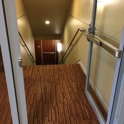 UW Medicine Primary Care at Issaquah - Door from the 2nd floor to stairway corridor was momentarily open, but should be propped open for ventilation.