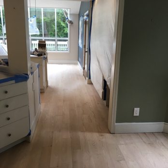 Mythical Hardwood Floors - an empty room with a view of the living room - Flooring Near Me Mythical Hardwood Floors - an empty room with a view of the living room - Flooring Near Me