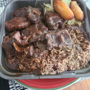 Golden Krust - Oxtail, beans and rice. Cabbage and Plantains - Caribbean Near Me - College Park, Georgia
