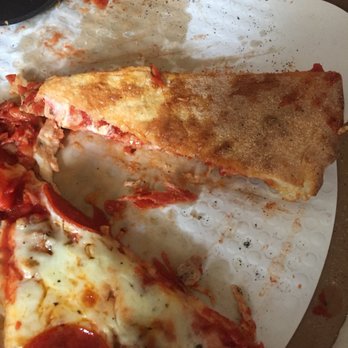 Garibaldi's Italian Eatery - Underbaked/soggy sausage, olives, and onions. - Pizza Near Me - Hoffman Estates, Illinois