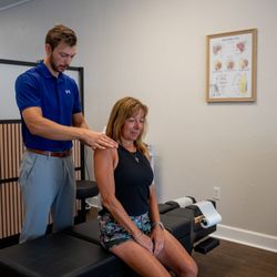 Chiropractic Pain Solutions - Muscle tension release being performed on a patient with chronic neck pain