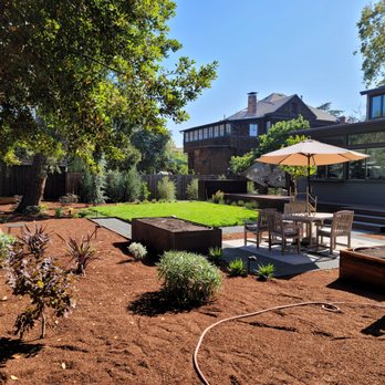 Bay Area Lawn Care - a patio with a table and chairs - Lawn Services Near Me Bay Area Lawn Care - a patio with a table and chairs - Lawn Services Near Me