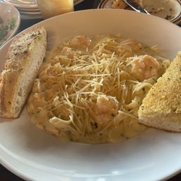 Fettuccine Alfredo with shrimp and garlic bread. Fettuccine Alfredo with shrimp and garlic bread.