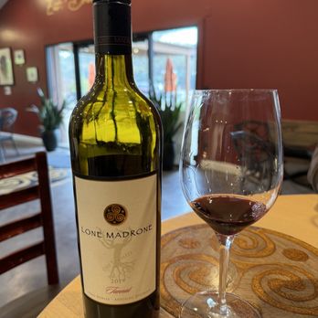 Lone Madrone - a glass of wine and a bottle of wine - Wineries Near Me - Templeton, California