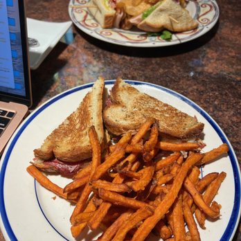 White Wolf Cafe - Club Sandwich with homemade chips, Reuben with sweet potato fries - New American Near Me - Orlando, Florida White Wolf Cafe - Club Sandwich with homemade chips, Reuben with sweet potato fries - New American Near Me - Orlando, Florida