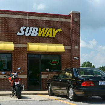 Subway - a black car parked in front of a subway restaurant - Fast Food Near Me - Marion, North Carolina