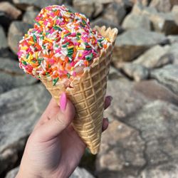 Dairy Maid - Orange pineapple ice cream. Waffle cone & rainbow sprinkles
