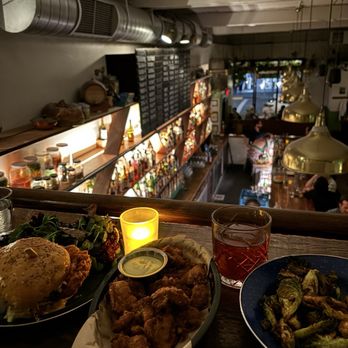 The Snug - Popcorn Chicken with Yuzu Mayo, Brussels Sprouts, Fried Chicken Sandwich - Cocktail Bars Near Me - San Francisco, California The Snug - Popcorn Chicken with Yuzu Mayo, Brussels Sprouts, Fried Chicken Sandwich - Cocktail Bars Near Me - San Francisco, California
