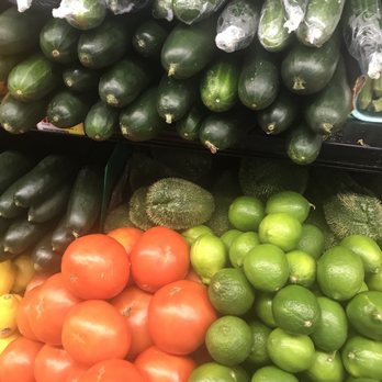 La Marqueta - a display of cucumbers and tomatoes - Grocery Near Me - Mount Kisco, New York La Marqueta - a display of cucumbers and tomatoes - Grocery Near Me - Mount Kisco, New York