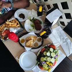 Mr Greek Restaurant - Gyro sandwich with fries, zucchini fritters, pita bread, and large Greek salad.