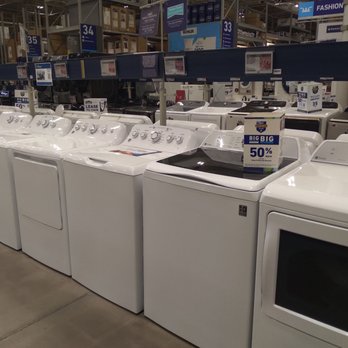 Lowe's Home Improvement - Great appliance department! - Multiple washing machines and dryers are lined up in a retail store aisle, with signage indicating discounts and leasing options. - Hardware Stores Near Me - Elyria, Ohio
