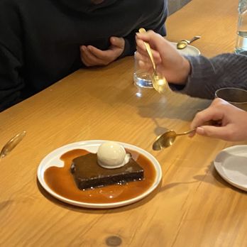 Tomat - Sticky toffee pudding with burnt milk gelato and butterscotch sauce. Beautiful cutlery and dishware. - New American Near Me - Los Angeles, California