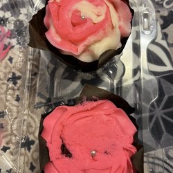 Petite Bakery - 2 cupcakes that were put in plastic shell that flattened the roses.Should not have accepted them
