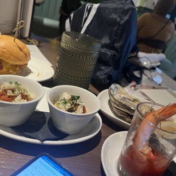Granger's - Cowboy Slider, Crab Hushpuppies, Shrimp Cocktail  (Large shrimp), and Oyster on the half shell. - Seafood Near Me - Houston, Texas