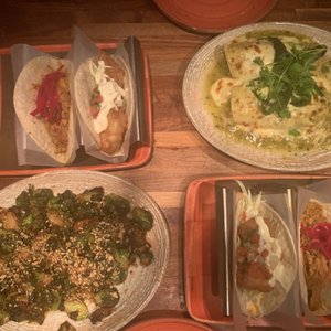 Photo of Oyamel - Washington, DC, United States. Fish taco, pork taco, chicken enchiladas, Brussels sprouts