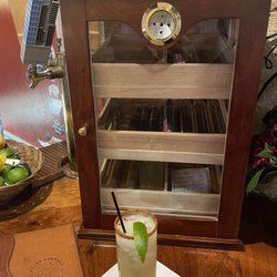 White Buffalo Bar - The Spicy Cowgirl in front of the humidor