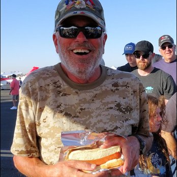 Dave's Dawgs - I'm a happy guy, as I'm holding an amazing "Bratwurst Dog," as I enjoy the "Lincoln Airport Open House." - Hot Dogs Near Me - Mcclellan Park, California Dave's Dawgs - I'm a happy guy, as I'm holding an amazing "Bratwurst Dog," as I enjoy the "Lincoln Airport Open House." - Hot Dogs Near Me - Mcclellan Park, California