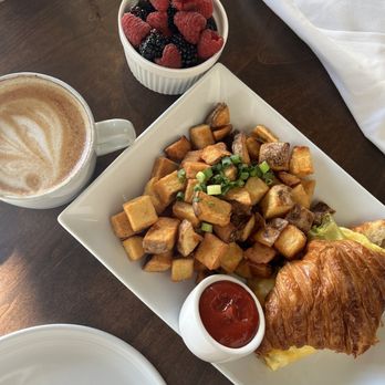 Onefold - Croissant egg sandwich (scrambled egg, avocado), breakfast potatoes, side of fruit, oat milk latte - Breakfast & Brunch Near Me - Denver, Colorado Onefold - Croissant egg sandwich (scrambled egg, avocado), breakfast potatoes, side of fruit, oat milk latte - Breakfast & Brunch Near Me - Denver, Colorado