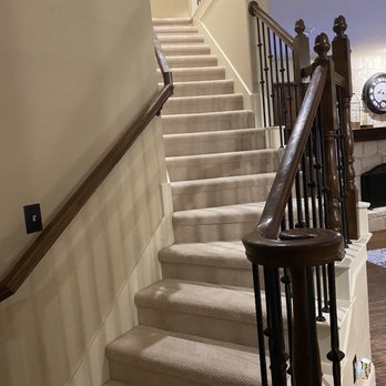 Peek's Carpet - a staircase leading to a living room - Carpeting Near Me - Richardson, Texas