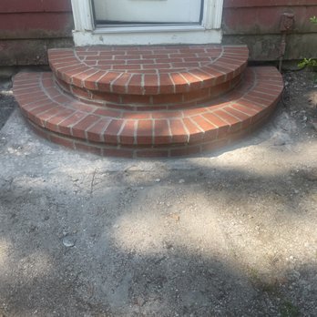 Weathershield Masonry & Contractors - the old foundation is visible. they did not cover the area well or clean up the old foundation. they also left rubble around. - Roofing Near Me - Holden, Massachusetts