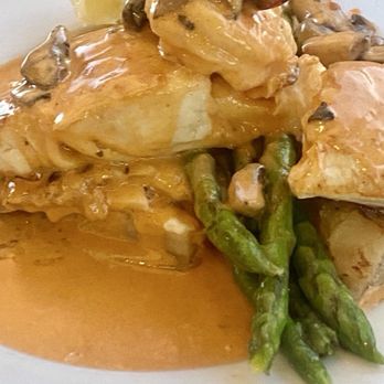 Sandbar & Grill - Halibut topped with Shrimp in a mustard cream sauce served with asparagus. - Seafood Near Me - Monterey, California Sandbar & Grill - Halibut topped with Shrimp in a mustard cream sauce served with asparagus. - Seafood Near Me - Monterey, California