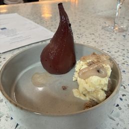 Poached pear and ice cream showed Poached pear and ice cream showed