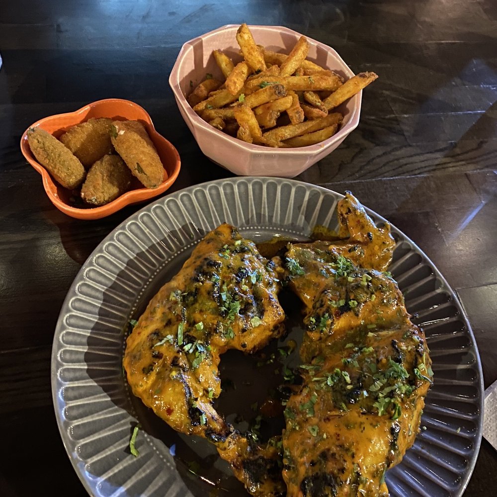 Half chicken with fries and Jalapeno Poppers Half chicken with fries and Jalapeno Poppers