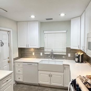 Bath World and More - a kitchen with white cabinets - General Contractors Near Me - Oldsmar, Florida Bath World and More - a kitchen with white cabinets - General Contractors Near Me - Oldsmar, Florida