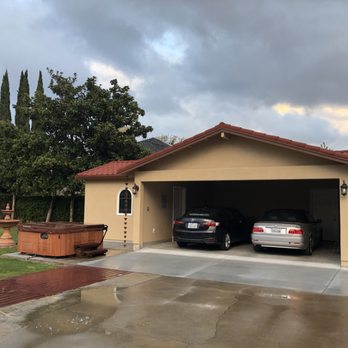 Sullivan Construction - two cars parked in a garage - General Contractors Near Me