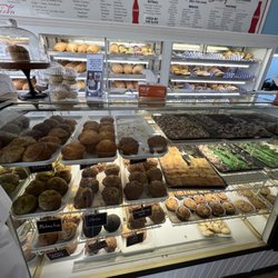 Giuliano's bakery - Display case showing muffins and part of the menu