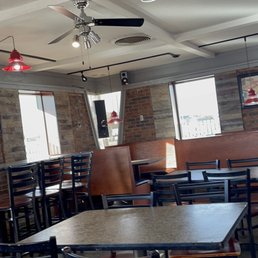 empty tables and chairs in a restaurant