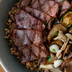 Som Bo - Grilled short rib with wok tossed farro, charred brussel sprouts, and mixed mushroom
