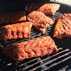 Green's Grocery - Baby back ribs smoking on one of our Big Green Eggs!