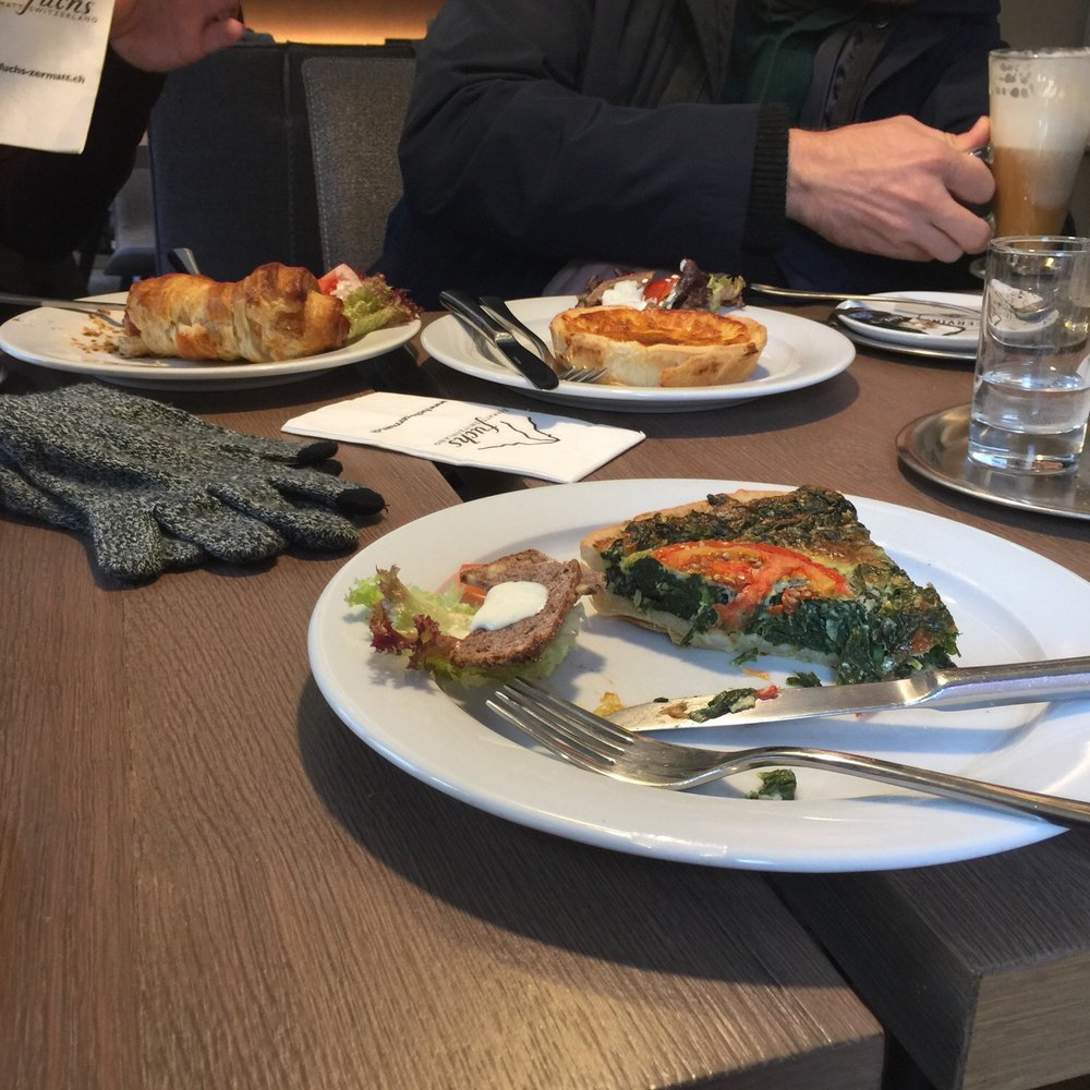 Spinach pie, cheese pie, hot dog wrapped with croissant and Irish coffee Spinach pie, cheese pie, hot dog wrapped with croissant and Irish coffee