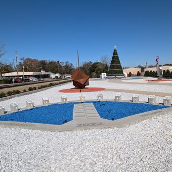 Statesboro Art Park - 2022 Leadership Bulloch installation with blue rocks. "Cubed" by Beth Nybeck in the distance. Photo taken Friday, November 28, 2025. - Parks Near Me - Statesboro, Georgia Statesboro Art Park - 2022 Leadership Bulloch installation with blue rocks. "Cubed" by Beth Nybeck in the distance. Photo taken Friday, November 28, 2025. - Parks Near Me - Statesboro, Georgia